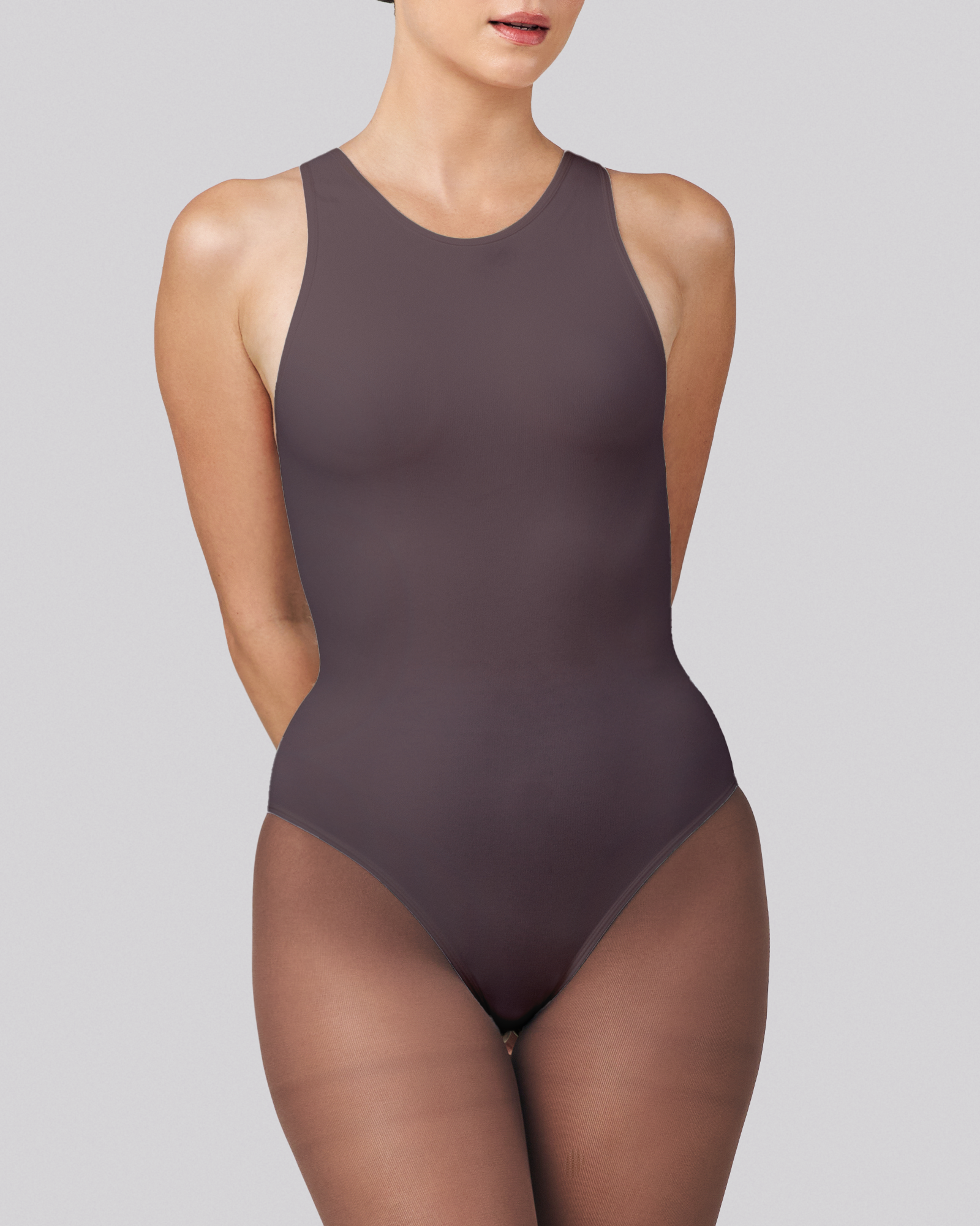 Brown bodysuit worn by a model on a gray background