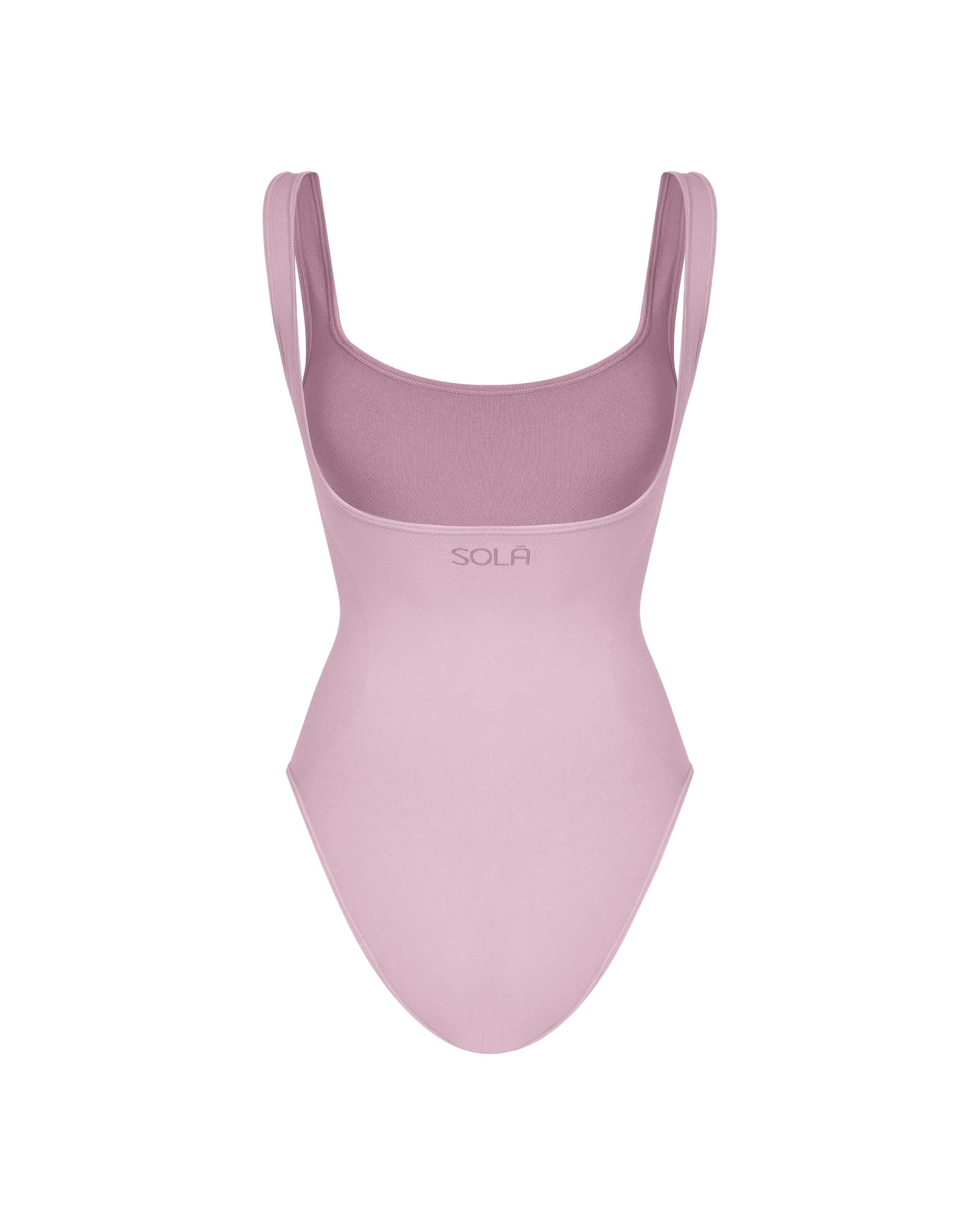 Pink swimsuit with thin straps on a white background