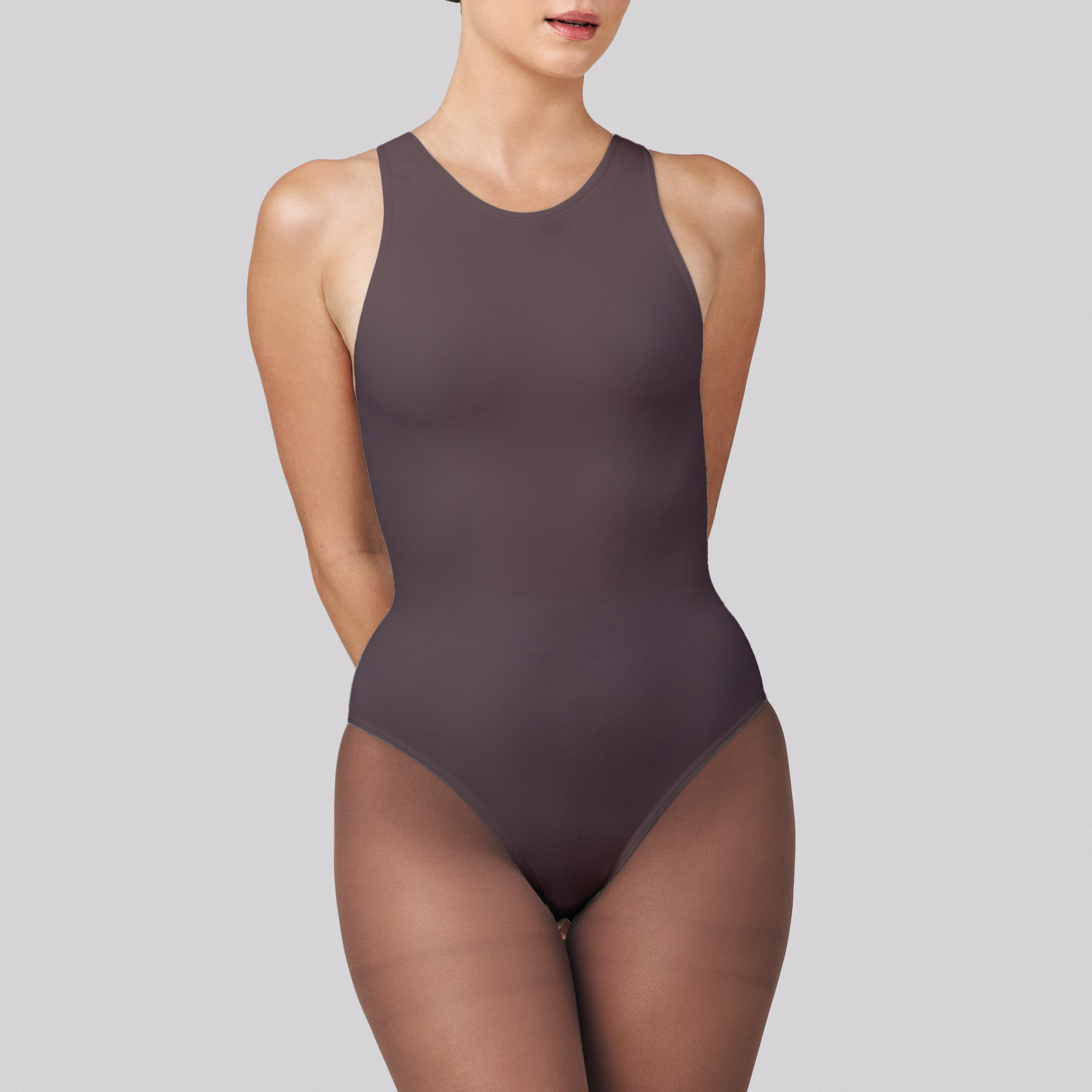 Brown bodysuit worn by a model on a gray background