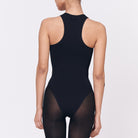 A woman wearing a black shapewear
