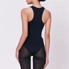 A woman wearing a black shapewear