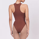 A woman wearing a teddy shapewear