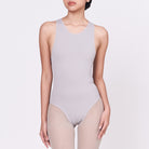 A woman wearing a stone shapewear