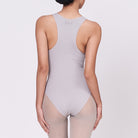 A woman wearing a stone shapewear