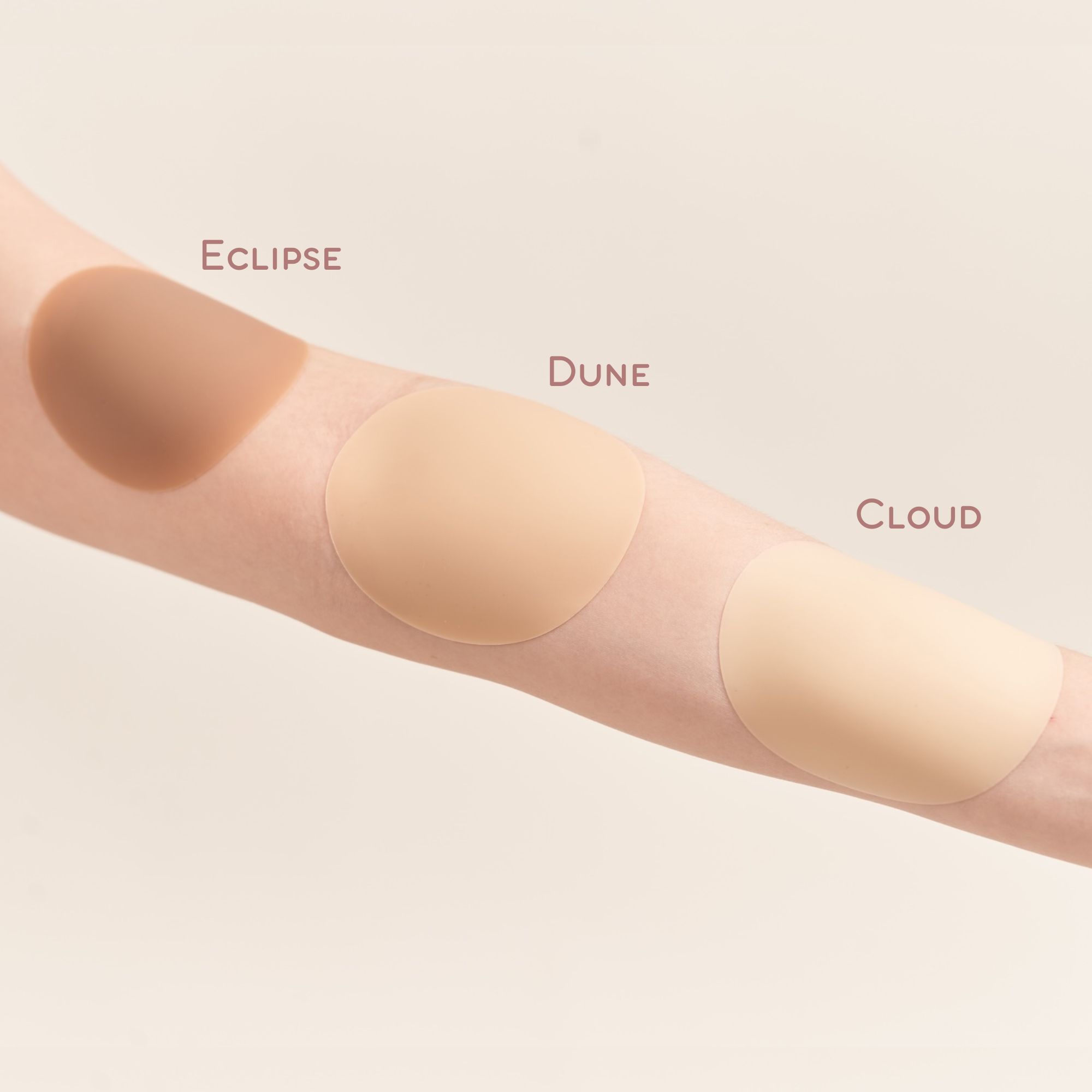 Arm showcasing different shades of nipple cover 